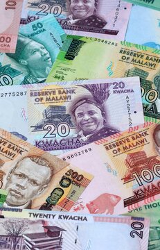 Malawian kwacha money banknotes bunch on table. Malawi bills of MWK currency