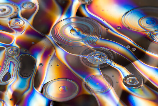 A colorful and vibrant abstract image of iridescent circles and swirling patterns