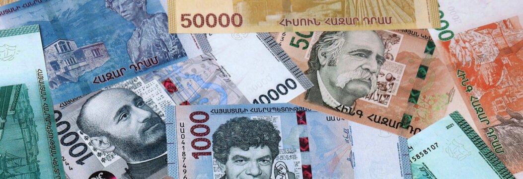 Armenian dram money banknotes bunch on table. Armenia bills of AMD currency close up