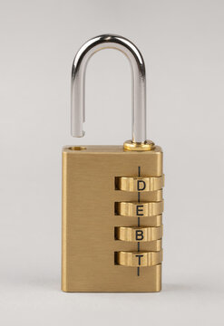 Unlocked Combination Lock Spelling Debt as Financial Freedom Concept
