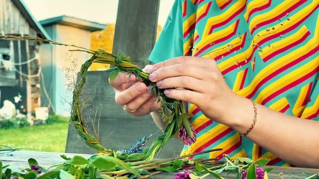 A close-up shows hands assembling a green flower crown. Ideal for midsummer festival promotions, DIY craft tutorials, eco-friendly marketing, and lifestyle blogs.