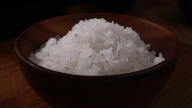 Dolly Shot of Natural Sea Salt in a Wooden Bowl