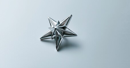 Fototapeta premium On a minimal light background, a sleek metallic star-shaped ornament highlights festive elegance and luxury.