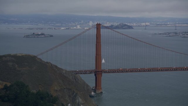 Golden Gate Bridge With Sailboats In Bay On Stormy Day - Aerial Shot