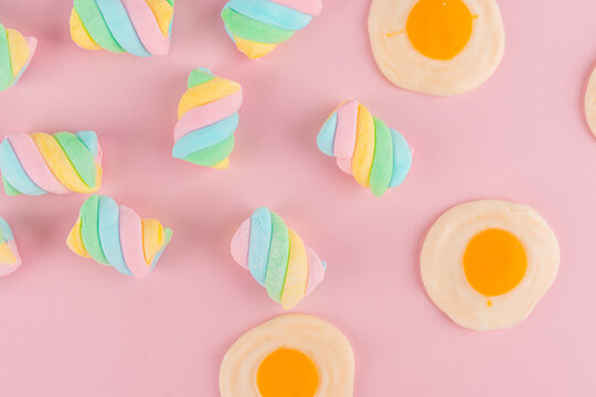 Marshmallow pastel colors and Fried egg jelly, dessert, snack, on pink background look so sweet