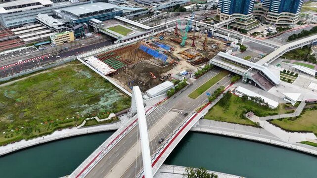 Aerial view of Busan station and surrounding construction site with a modern bridge and urban infrastructure in Busan, Busan, South Korea.