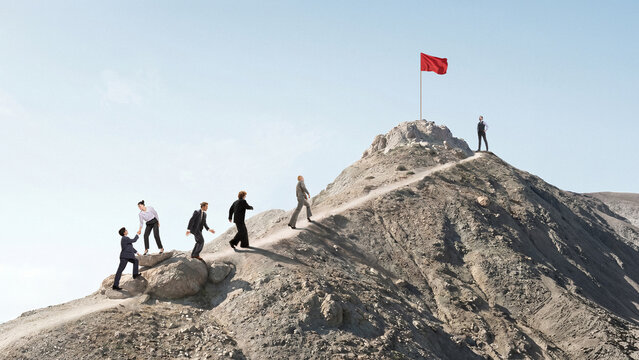 Business people walking toward red flag on mountain as goal achievement. Concept of strategic planning, business leadership, team motivation, milestone achievement, long-term success.
