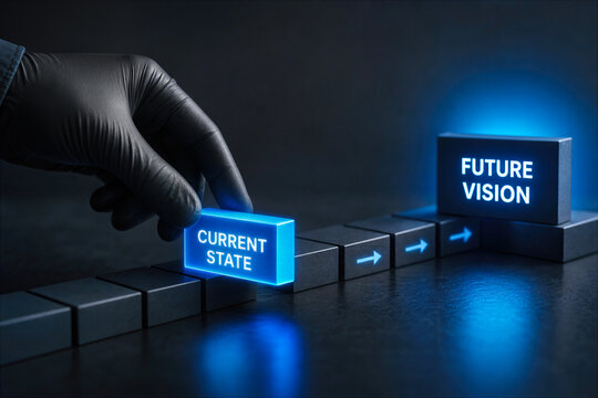 Gloved hand selecting glowing blue block labeled current state leading along arrow pathway to future vision concept transformation planning strategy roadmap change management