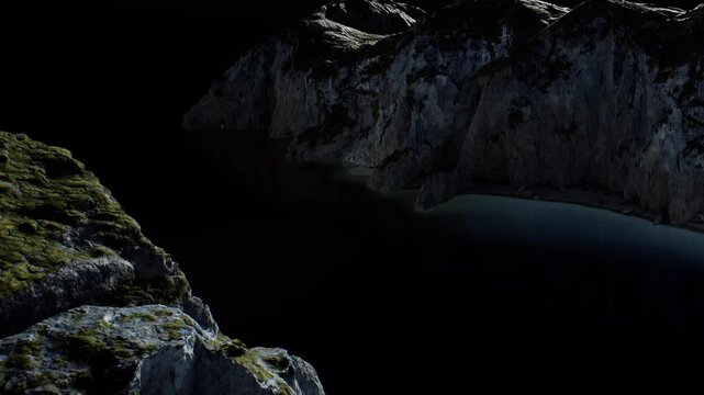 A rocky coast is visible at night with the water reflecting light. The cliffs are dark with few visible details. The scene shows a sense of isolation and natures features.