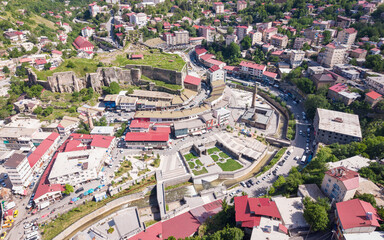 Fototapeta premium Aerial View of Bitlis City Center Surrounded by Historic Stone Architecture and Mountain Landscape in Eastern Turkiye