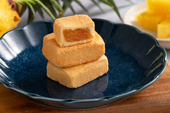 Traditional Taiwanese pineapple cake pastry served on ceramic plate.