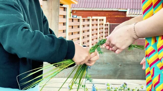 A side view shows hands collaborating to weave a traditional flower crown. Perfect for midsummer festival promos, eco-friendly branding, and DIY craft tutorials.