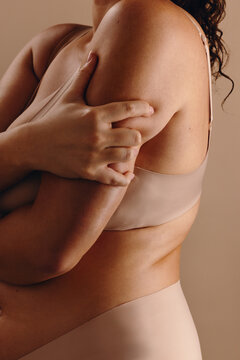 Self-care embrace of a woman's body and wellness