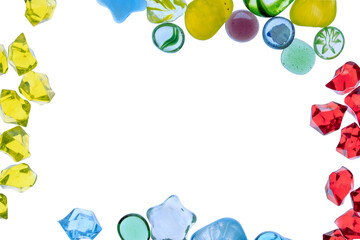 Obraz premium Assorted colorful glass pieces and marbles creating a vibrant decorative border around white copy space