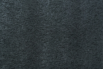 Fototapeta premium Dark rough fabric surface creating abstract texture background