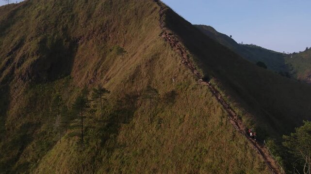 Aerial view of the Mount Andong climbing route via the Temu Kidul Basecamp. Drone footage of hiking trail in Central Java, Indonesia.