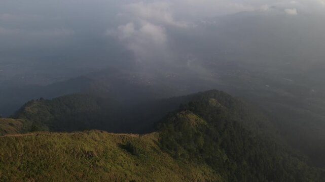 Aerial view of the Mount Andong climbing route via the Temu Kidul Basecamp. Drone footage of hiking trail in Central Java, Indonesia.