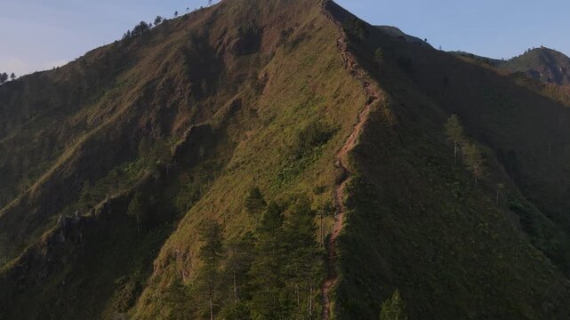 Aerial view of the Mount Andong climbing route via the Temu Kidul Basecamp. Drone footage of hiking trail in Central Java, Indonesia.