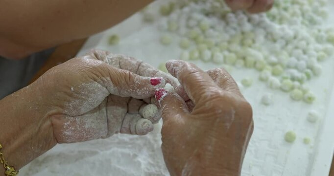 The meticulous process of making bua loi dough. highlighting preserving the art of traditional thai street food to create the authentic thai bua loi dessert.