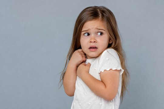Startled gaze of a small child reveals a profound sense of sudden dread