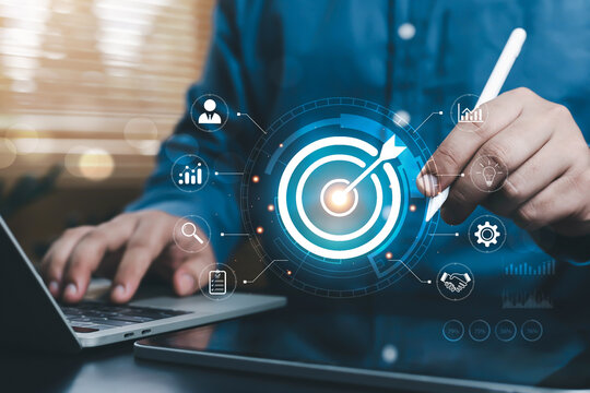 Business professional setting strategic goals on a digital target dashboard, representing business planning, KPI tracking, performance analytics, productivity improvement, success measurement,