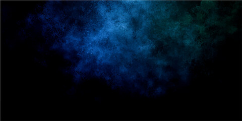 Blue and green smoke cloud swirling and drifting in the darkness, creating a mystical and abstract atmosphere. © Zìyóu