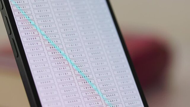 Columns of binary code on a white mobile device screen, computer language. Smartphone display, encryption, digital code, big data, blockchain, firewall, data privacy, computer technology.