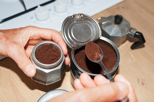 Filling Italian Moka Pot with Ground Coffee in Home Kitchen