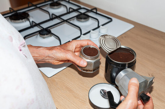 Filling Italian Moka Pot with Ground Coffee in Home Kitchen