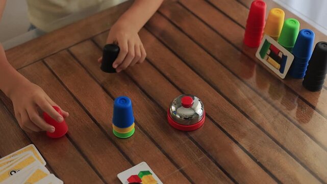 Young girl playing an educational card game at home