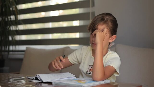 Young girl doing homework at home