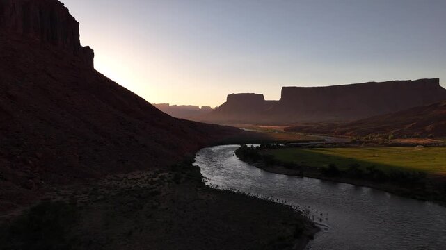 Drone flying sideways at the Colorado river at runrise in 4k