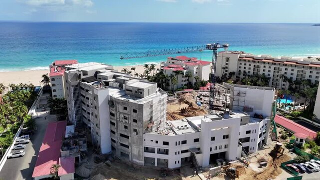 Drone orbiting a beachfront condominium project in San Jos&eacute; del Cabo, revealing Palmilla Point, the coastline, and the Gulf of California.