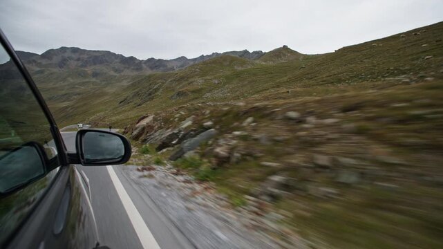 A beautiful panoramic view of the Alpine landscape from a car window. Travel and tourism in Europe.