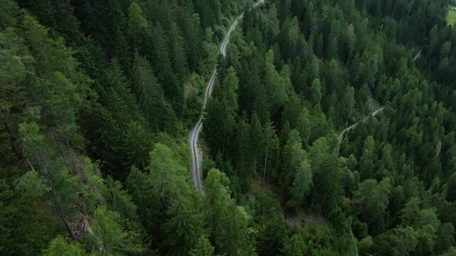 Aerial panorama of scenic mountain roads in Tyrol Austria with steep alpine curves evergreen forests and breathtaking landscapes for travel across Europe