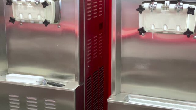 Close up of a soft serve ice cream machine