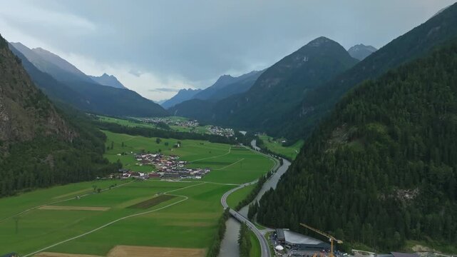 Scenic aerial landscape of traditional alpine villages in Tyrol Austria with dramatic mountain ridges lush forests and unforgettable travel destinations in Europe