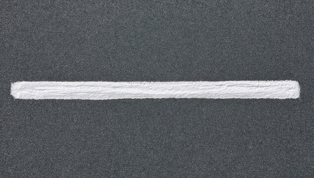 A stark white line bisects a textured dark gray background