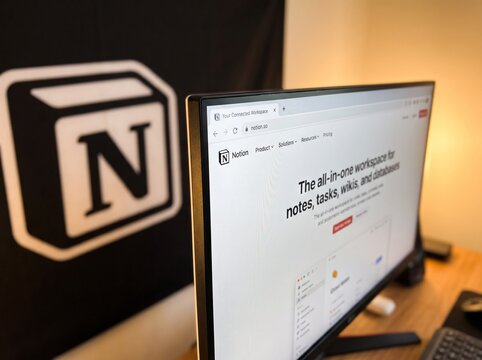 Close-Up of Notion Website on Computer Monitor with Brand Logo Flag in Background; All-in-one Workspace for Productivity, Notes, Tasks, and Project Management for Business Editorial Content Display.