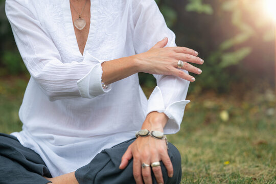 Energy healing technique with mindful body awareness and gentle self-touch to promote relaxation, balance, emotional well being and holistic wellness.