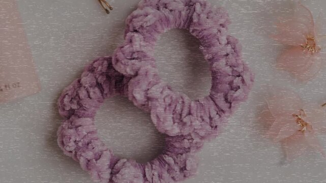 Trendy Silk Scrunchies animation. Trendy Silk Scrunchies Background. Set of Stylish Scrunchies on Color Background.