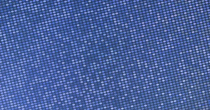 Abstract twinkling ovals background. Dense blue reflective ovals with sparkling highlights, smooth rotation in seamless loop. Ideal for fashion, glamour and abstract backgrounds.  