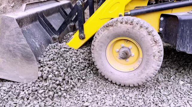 JCB Machine Leveling Gravel on Road Construction Site for Highway Infrastructure Development, Civil Engineering and Earthmoving Equipment Operations Progress