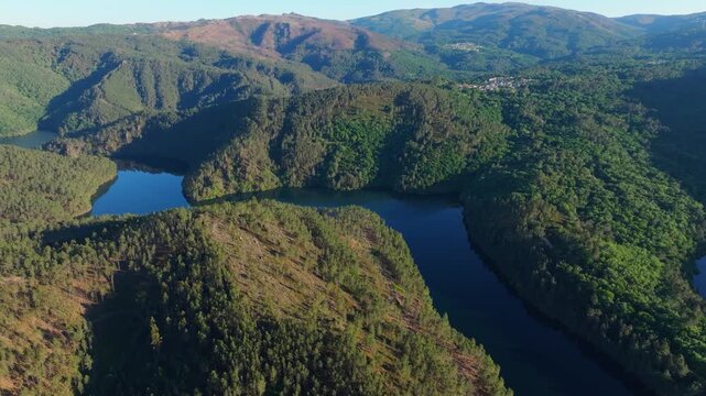 The Miradoiro do Castro Viewpoint Overlooking Forested Mountains And Avia River In Avi&oacute;n, Ourense Province Of Galicia, Spain. Aerial Wide Shot