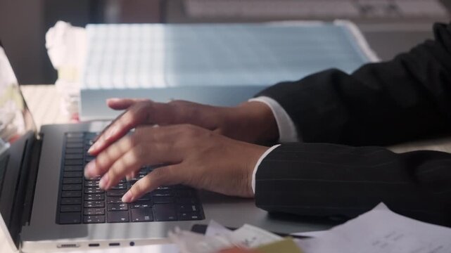 Professional Typing on Laptop for Data Entry and Office Tasks