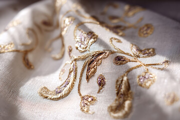 Naklejka premium Golden floral embroidery detail