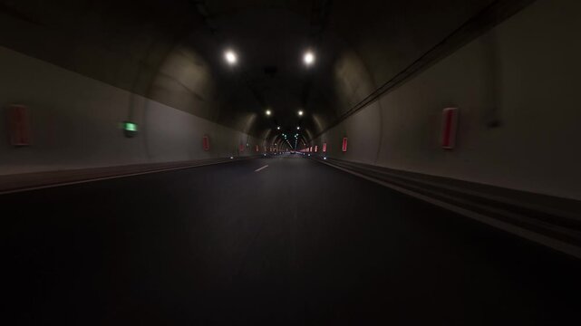 Driving Through a Dark Modern Highway Tunnel with Lights, POV Video