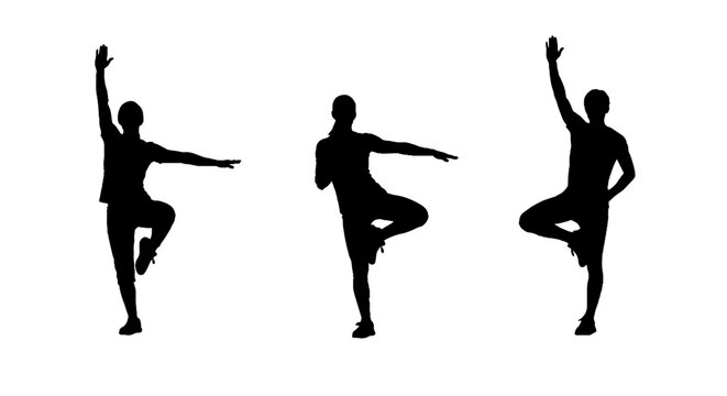 Silhouettes of dancers in dynamic poses performing ballet.