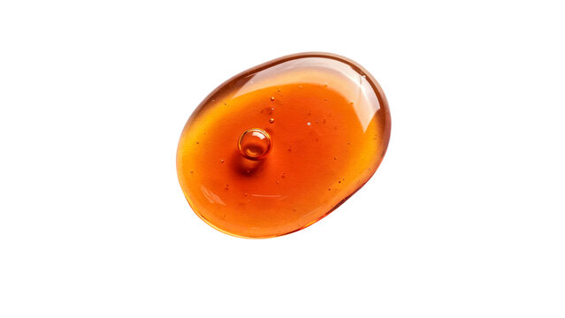 A single glossy drop of golden organic honey with small internal air bubbles captured in a top down macro studio shot isolated on transparent background