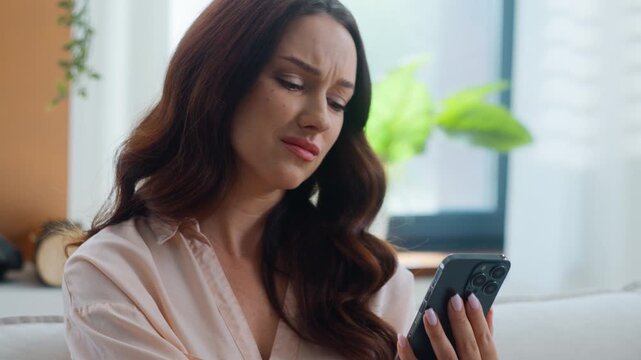Disappointed Caucasian woman chatting with mobile phone suffering with bank reject email receive breakup relationship message losing with smartphone female business girl businesswoman lost online bet